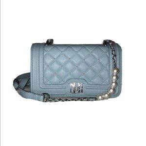 Blue quilted letter lock pearl crossbody bag.